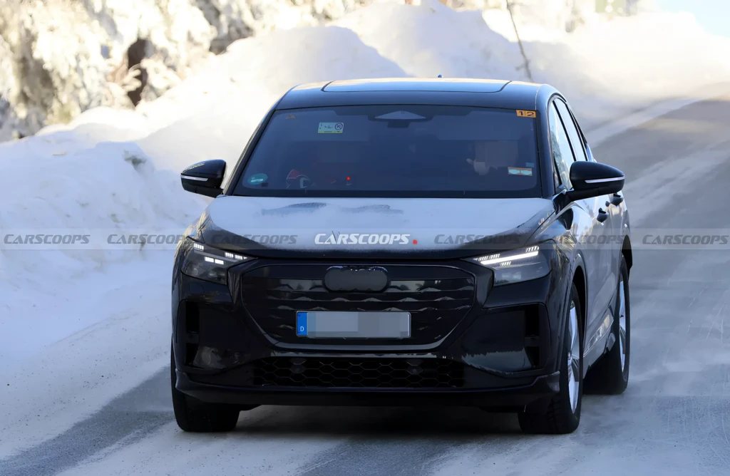 Зимові тести кросовера: фронтальний ракурс, чорний кузов, LED-фари, засніжена дорога