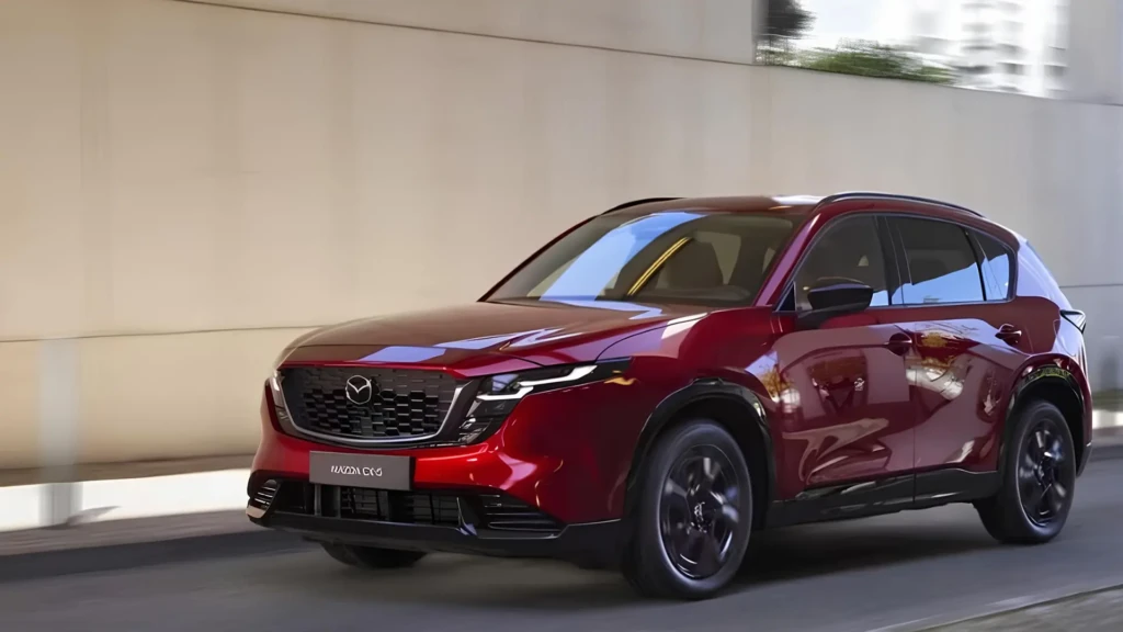 Mazda CX-5 Hybrid червоного кольору в русі, вид спереду збоку