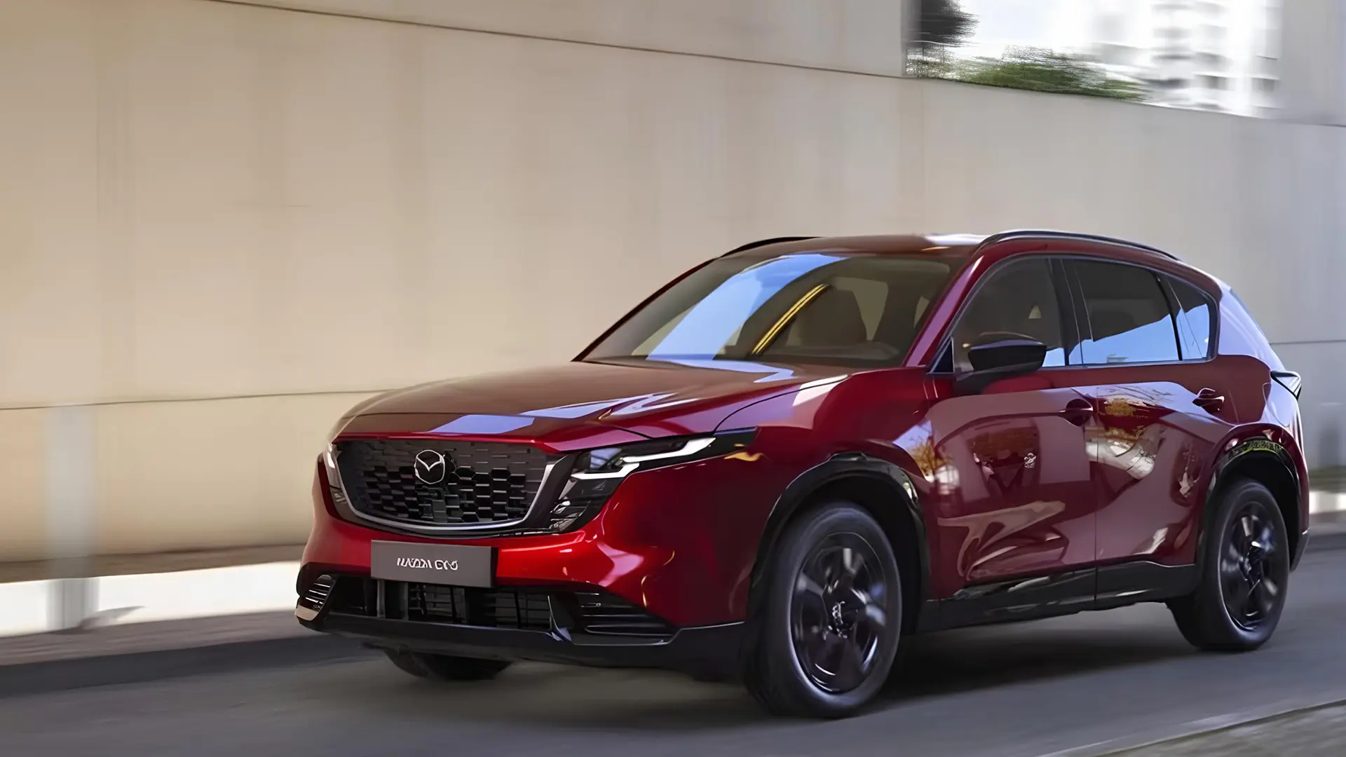 Mazda CX-5 Hybrid червоного кольору в русі, вид спереду збоку