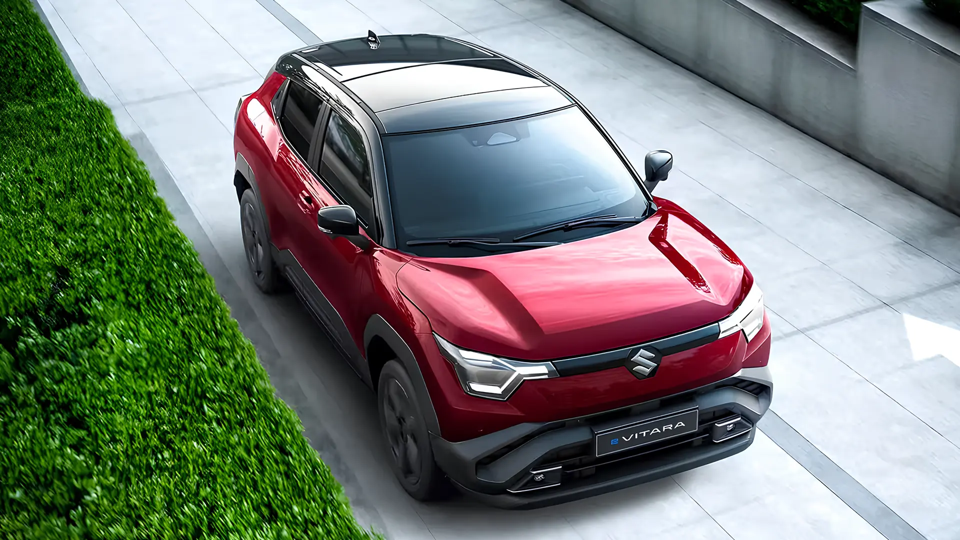 Suzuki e-Vitara 2026 червоного кольору, вигляд зверху спереду