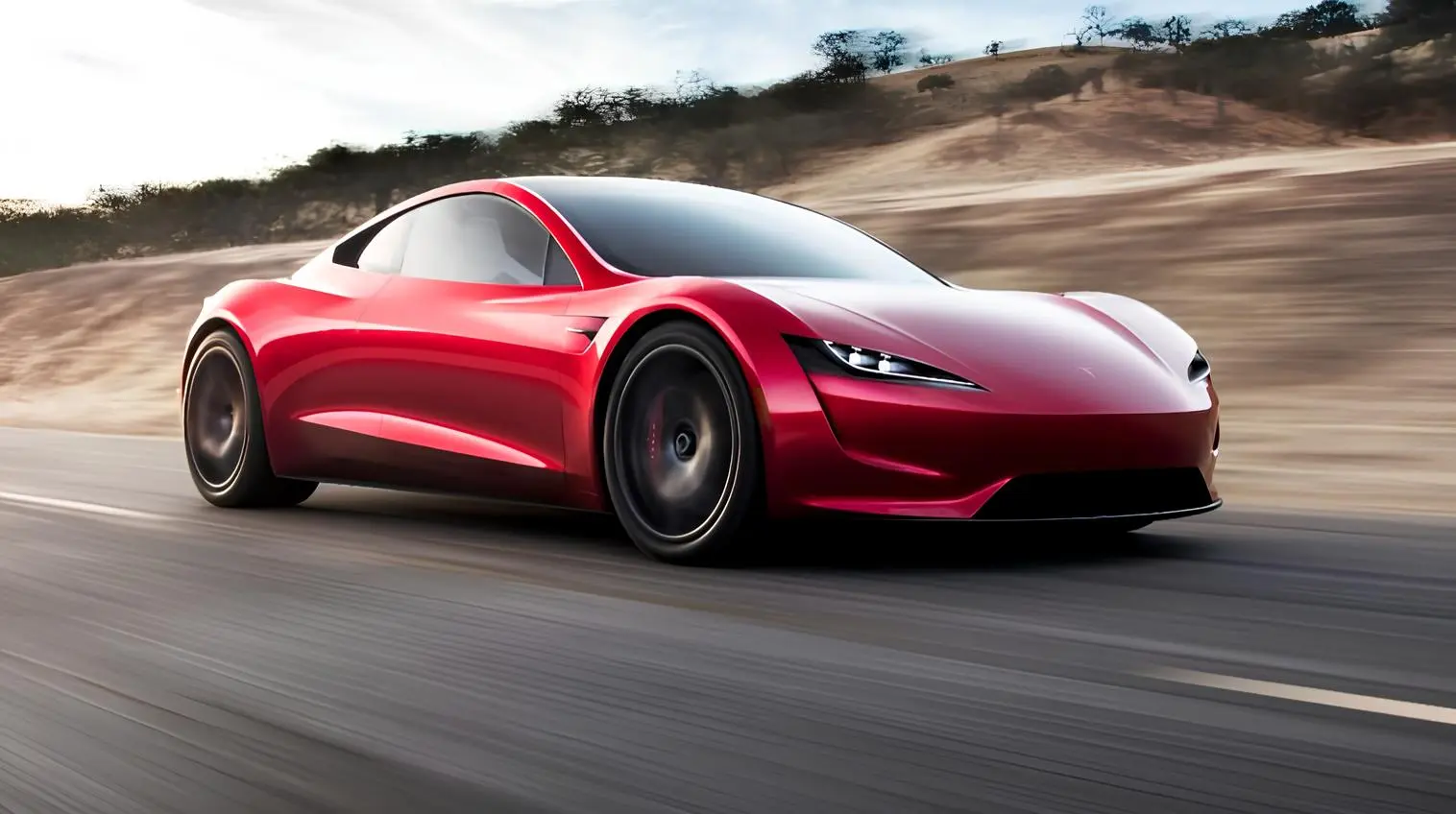 Новий Tesla Roadster: червоний електричний спорткар у русі трасою