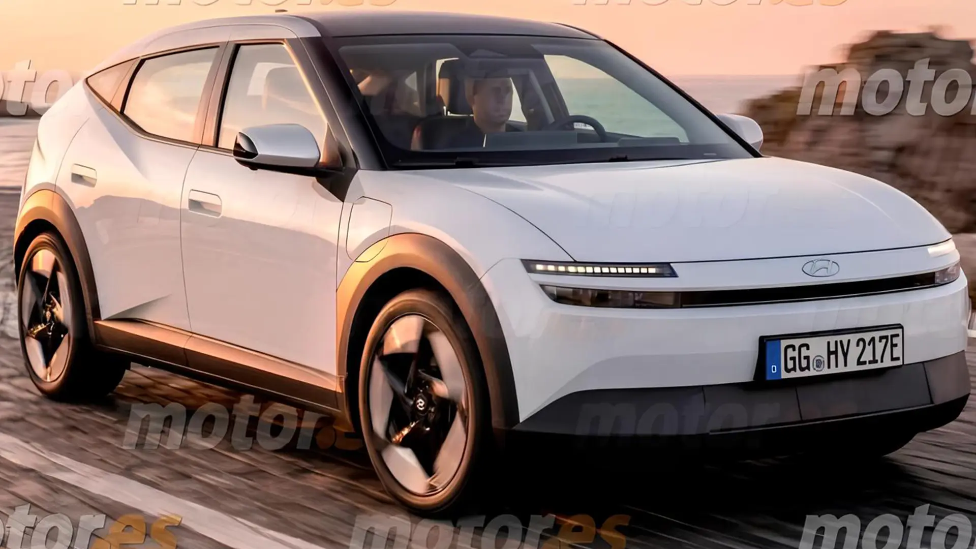 Новий Hyundai IONIQ 3 білого кольору під час руху дорогою, вид спереду збоку