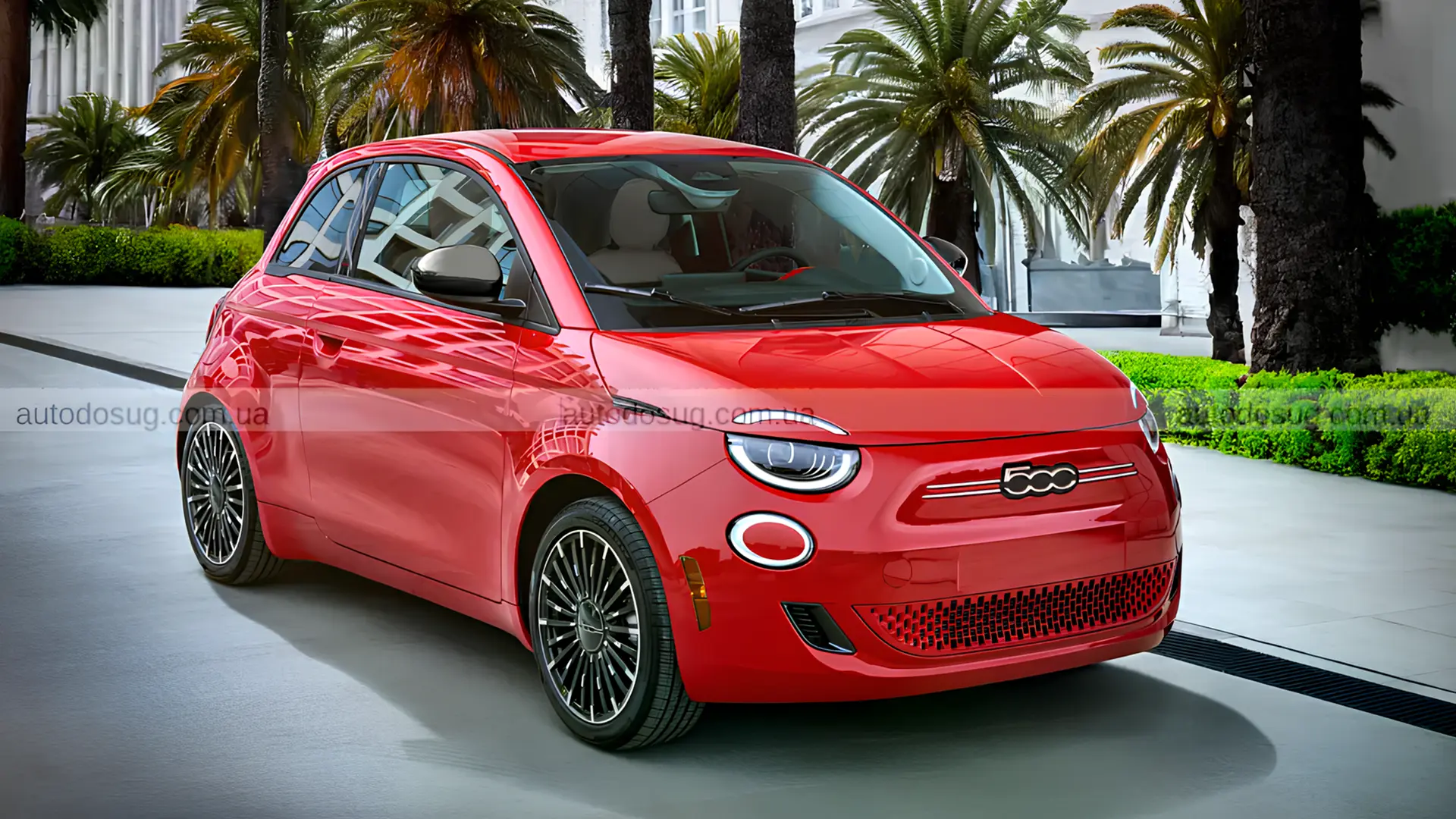 Червоний Fiat 500e 2026 припаркований біля будівлі з пальмами