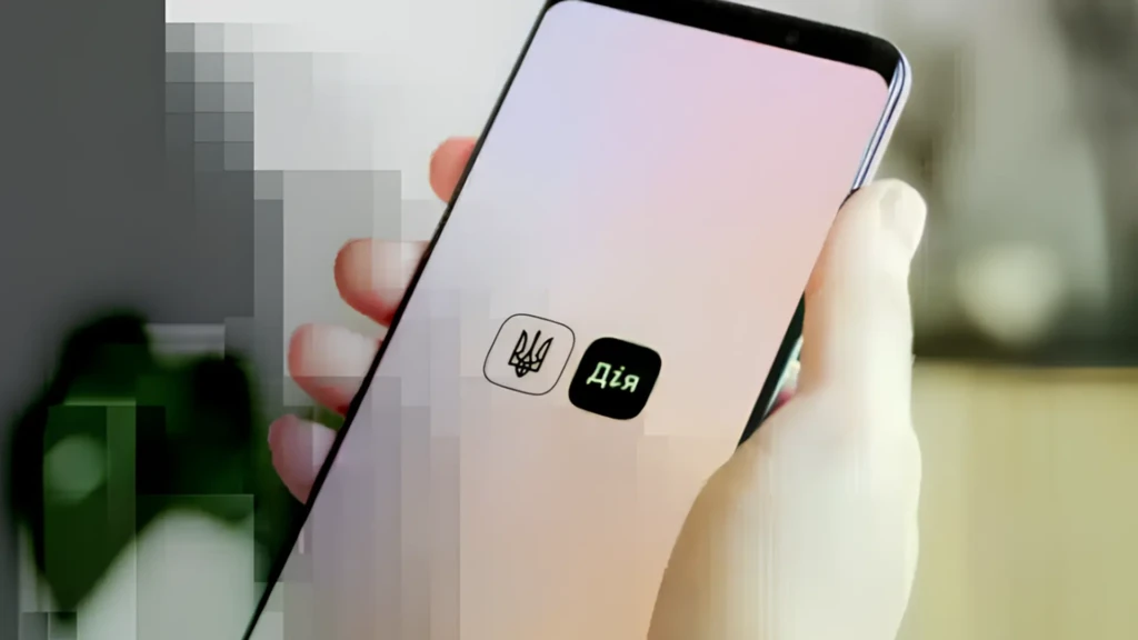 Смартфон із застосунком Дія в руці як ілюстрація купівлі авто в Дії та використання Дія.Підпису