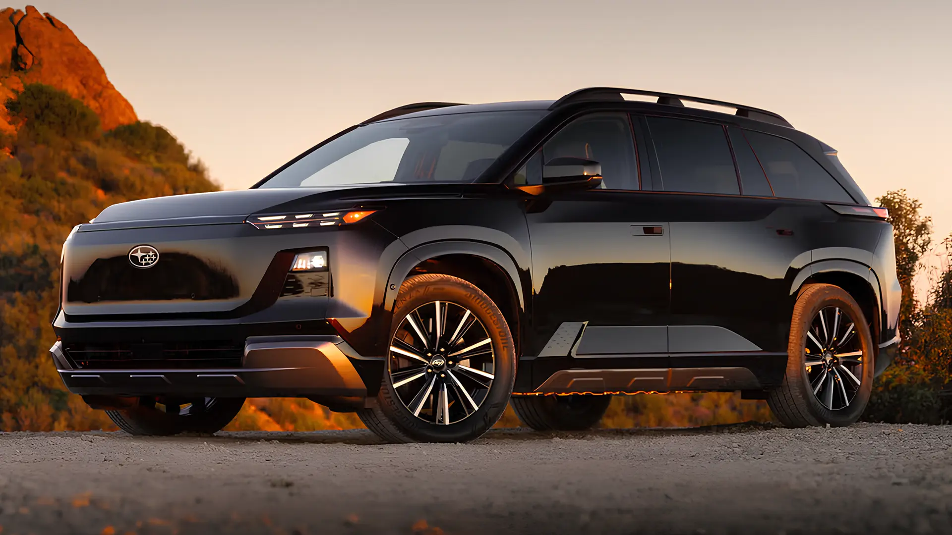 Чорний кросовер Subaru Getaway на тлі гірського пейзажу під час заходу сонця