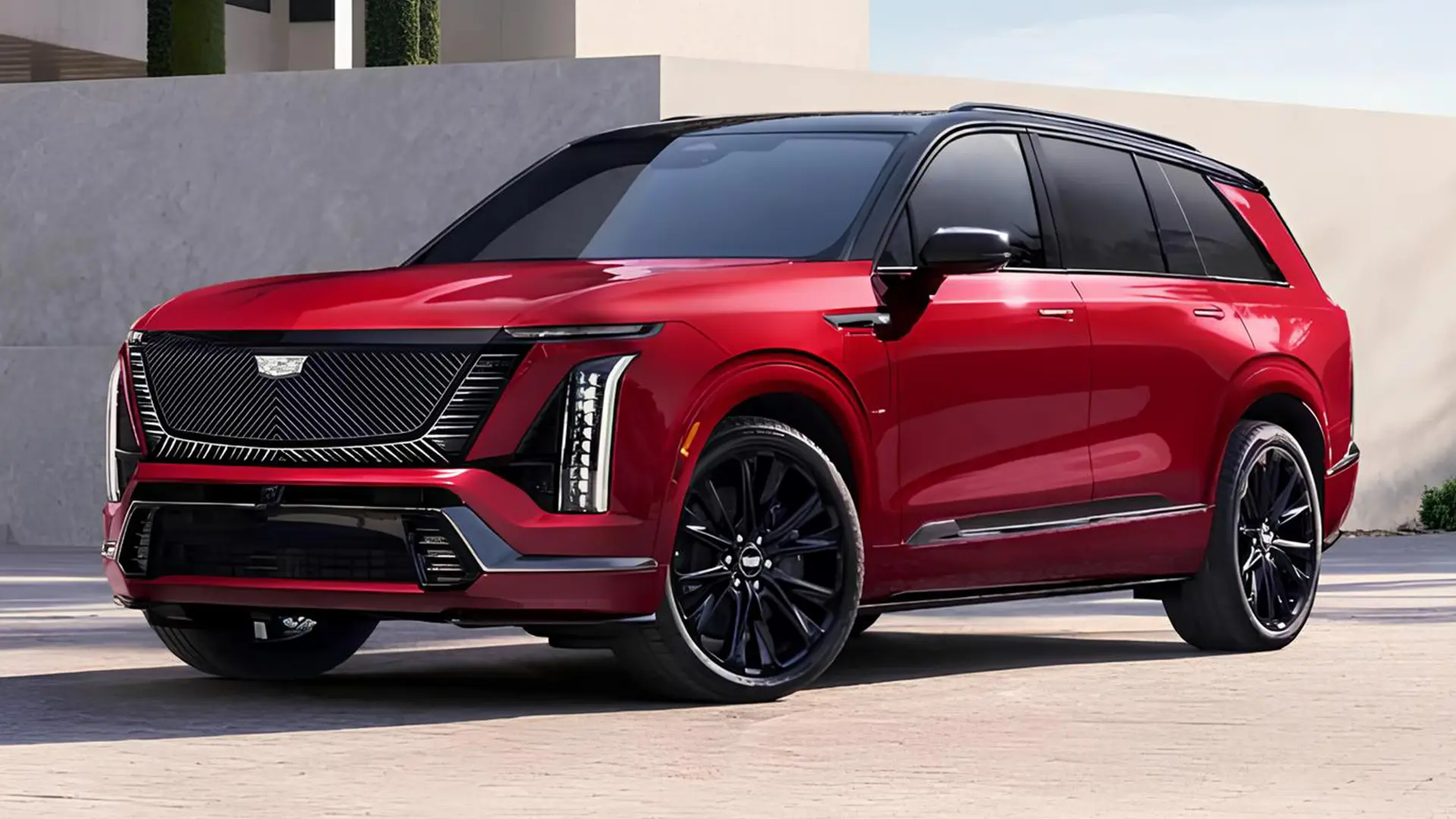 Червоний Cadillac Vistiq 2027 на тлі сучасної архітектури