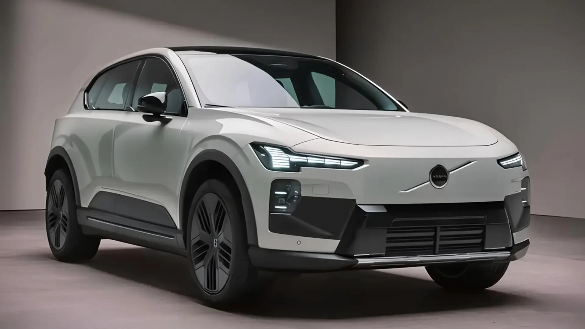Білий електрокросовер Volvo EX60 у студії