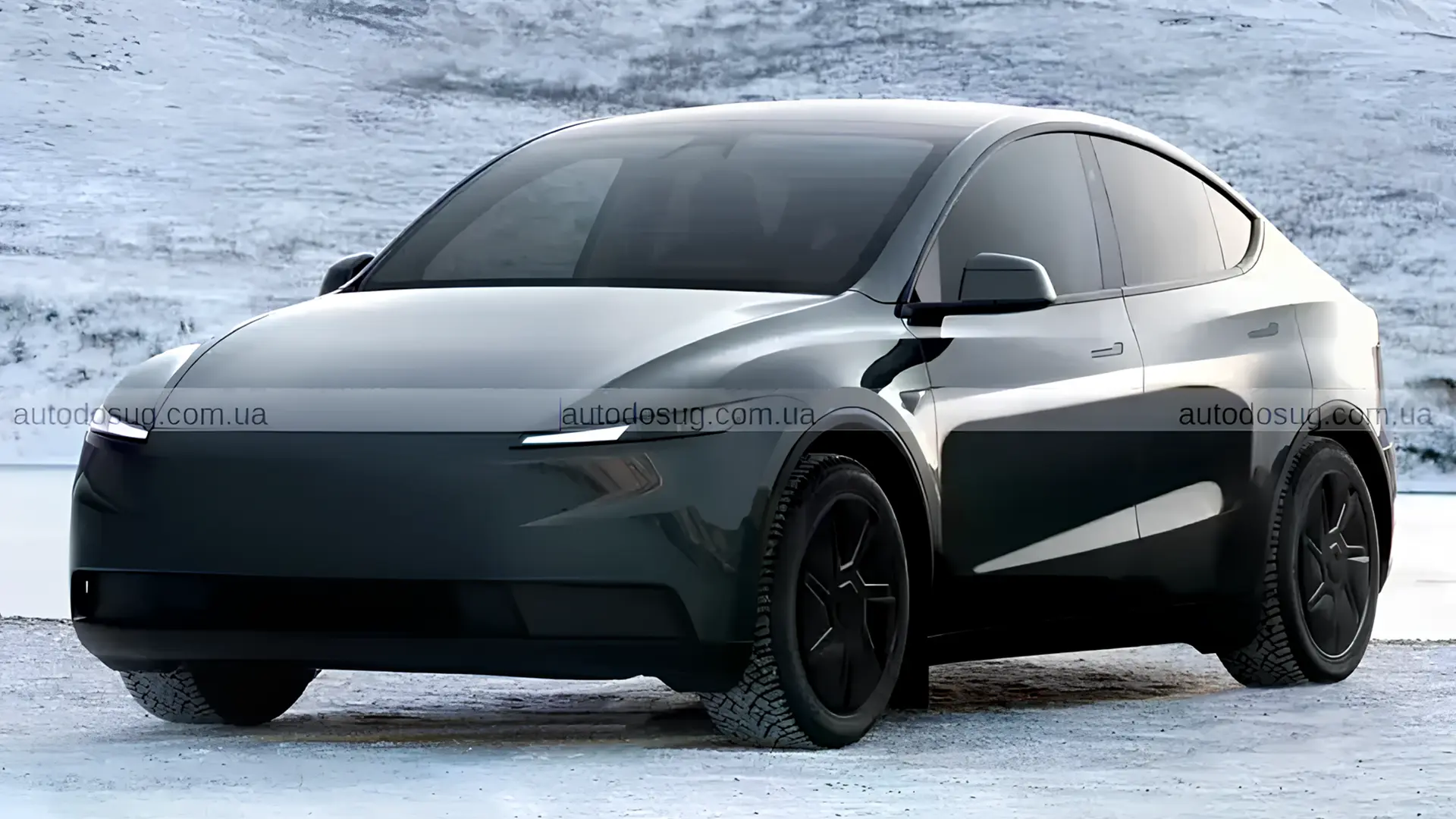 Темний Tesla Model Y на засніженій дорозі