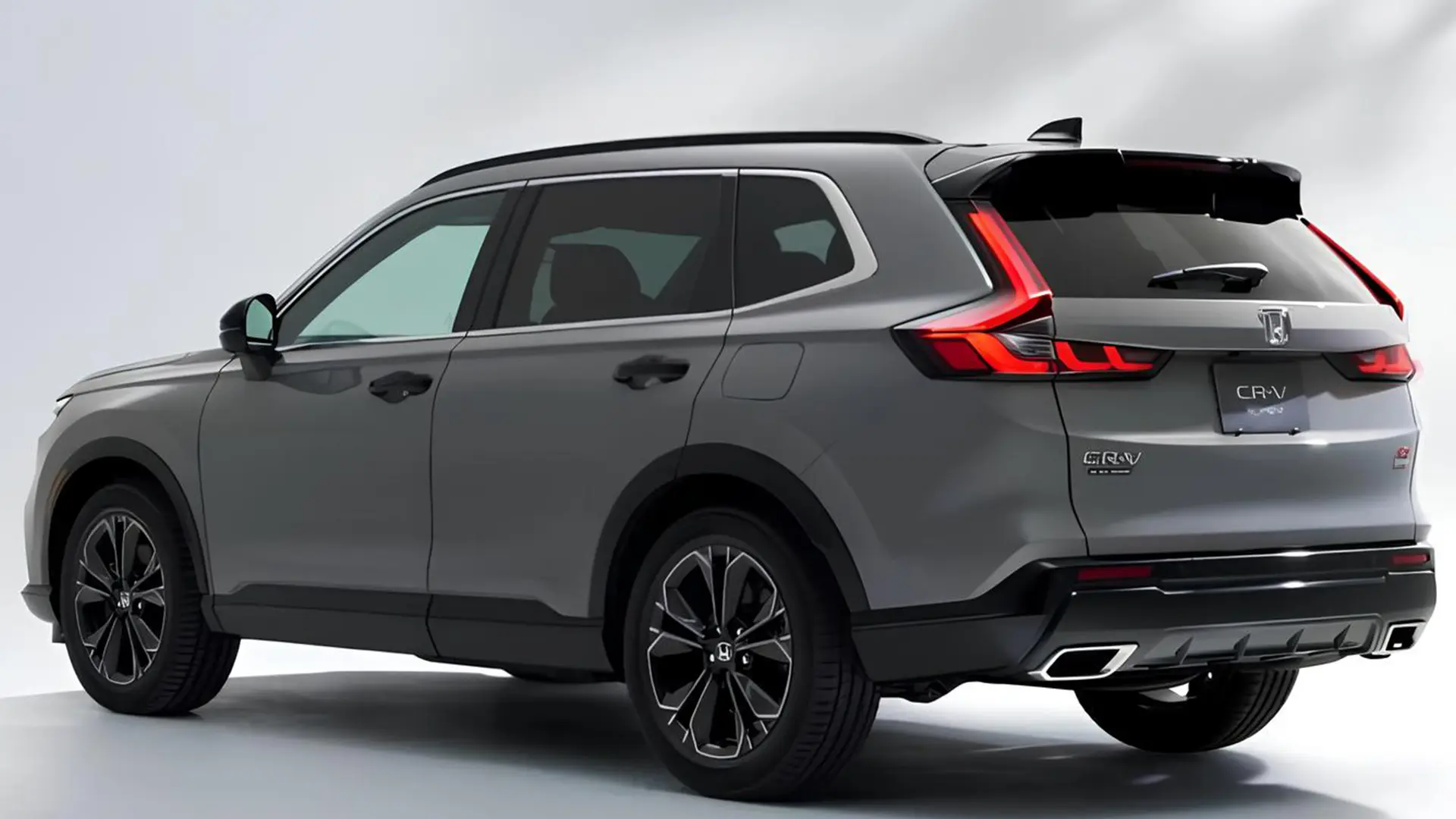Сірий Honda CR-V 2026, вигляд ззаду збоку на світлому фоні
