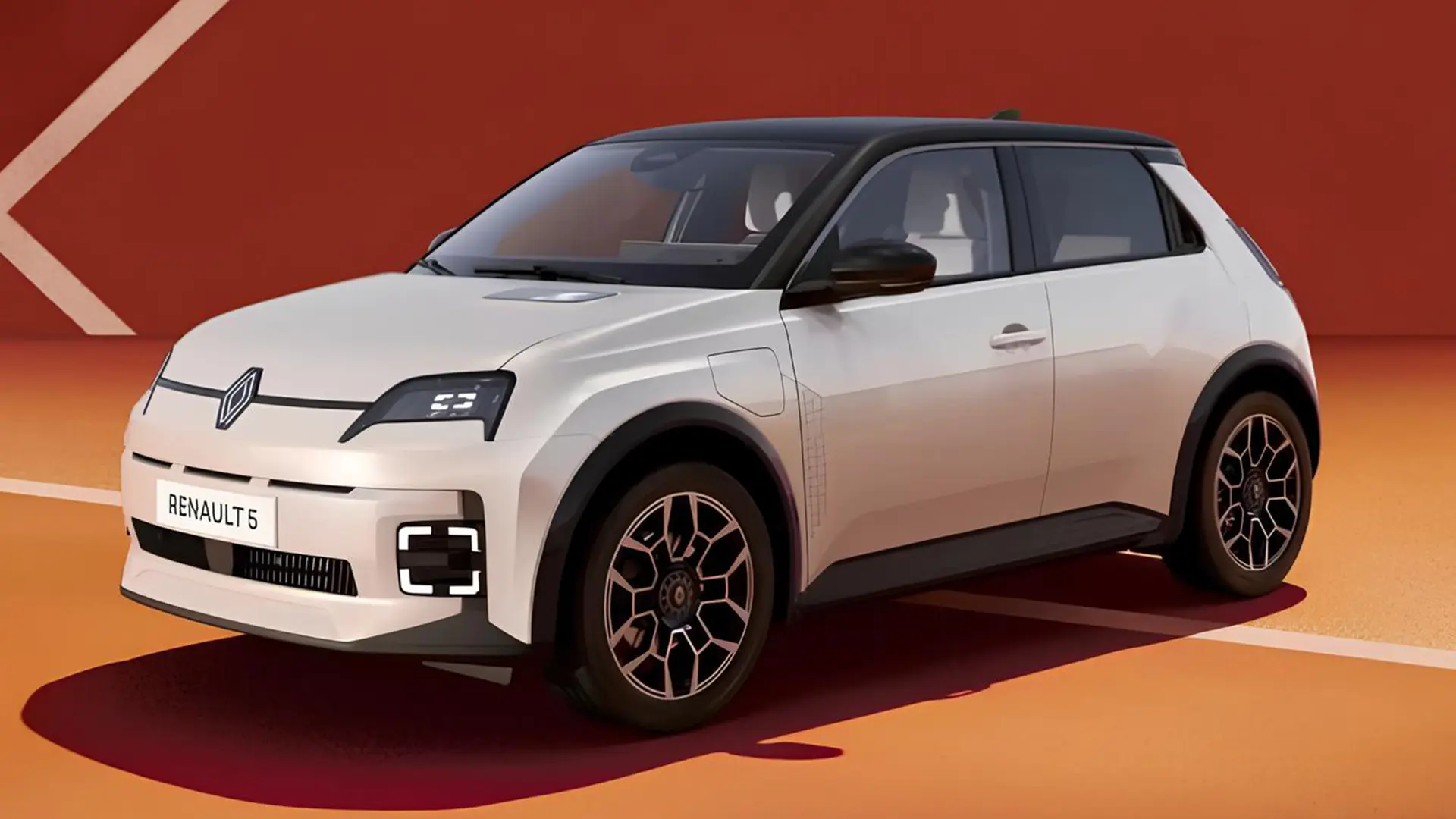 Білий Renault 5 E-Tech Electric на помаранчево-червоному фоні