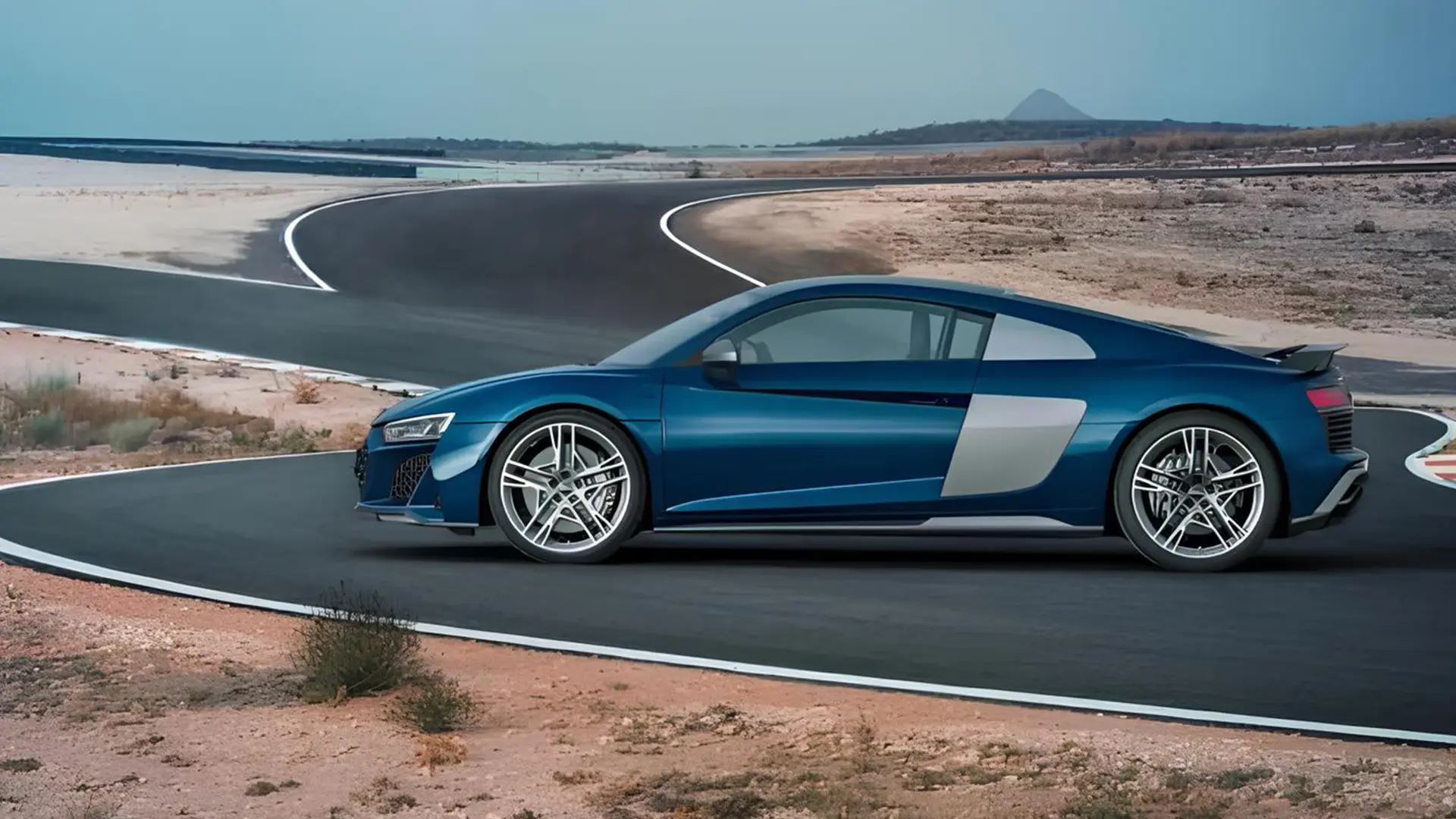 Синій Audi R8 на гоночній трасі в пустельному ландшафті