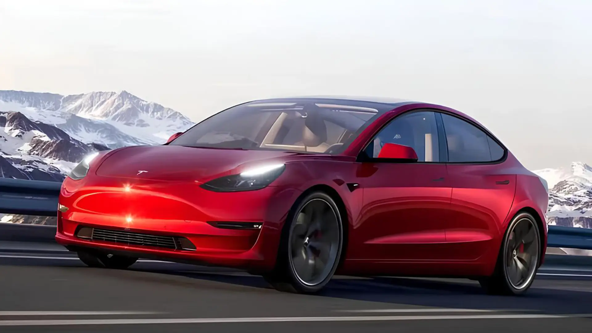 Червоний електромобіль Tesla на дорозі біля засніжених гір