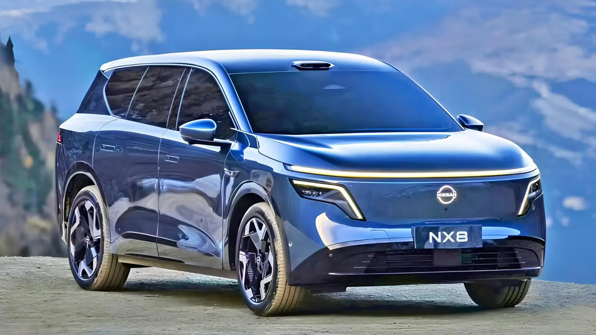 Синій Nissan NX8 на гірській дорозі біля озера