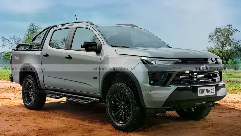 Сірий пікап Chevrolet S10 Trail Boss на ґрунтовій дорозі за містом