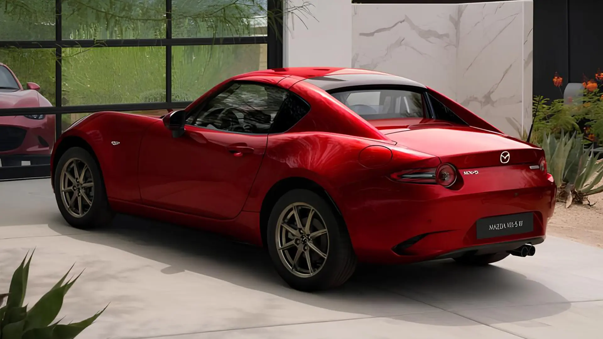 Червона Mazda MX-5 у сучасному автосалоні