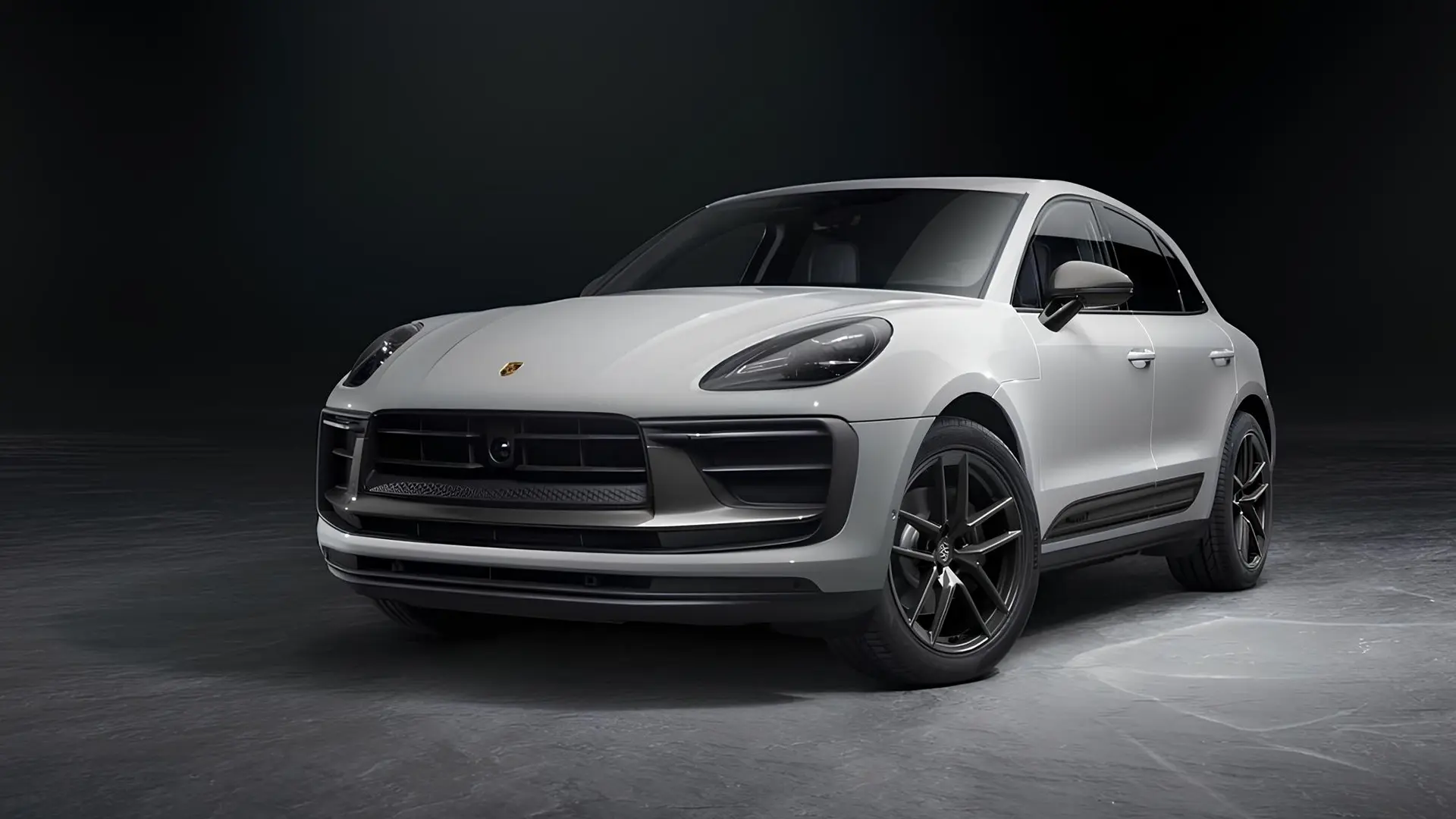 Білий Porsche Macan з ДВЗ у студії на темному фоні