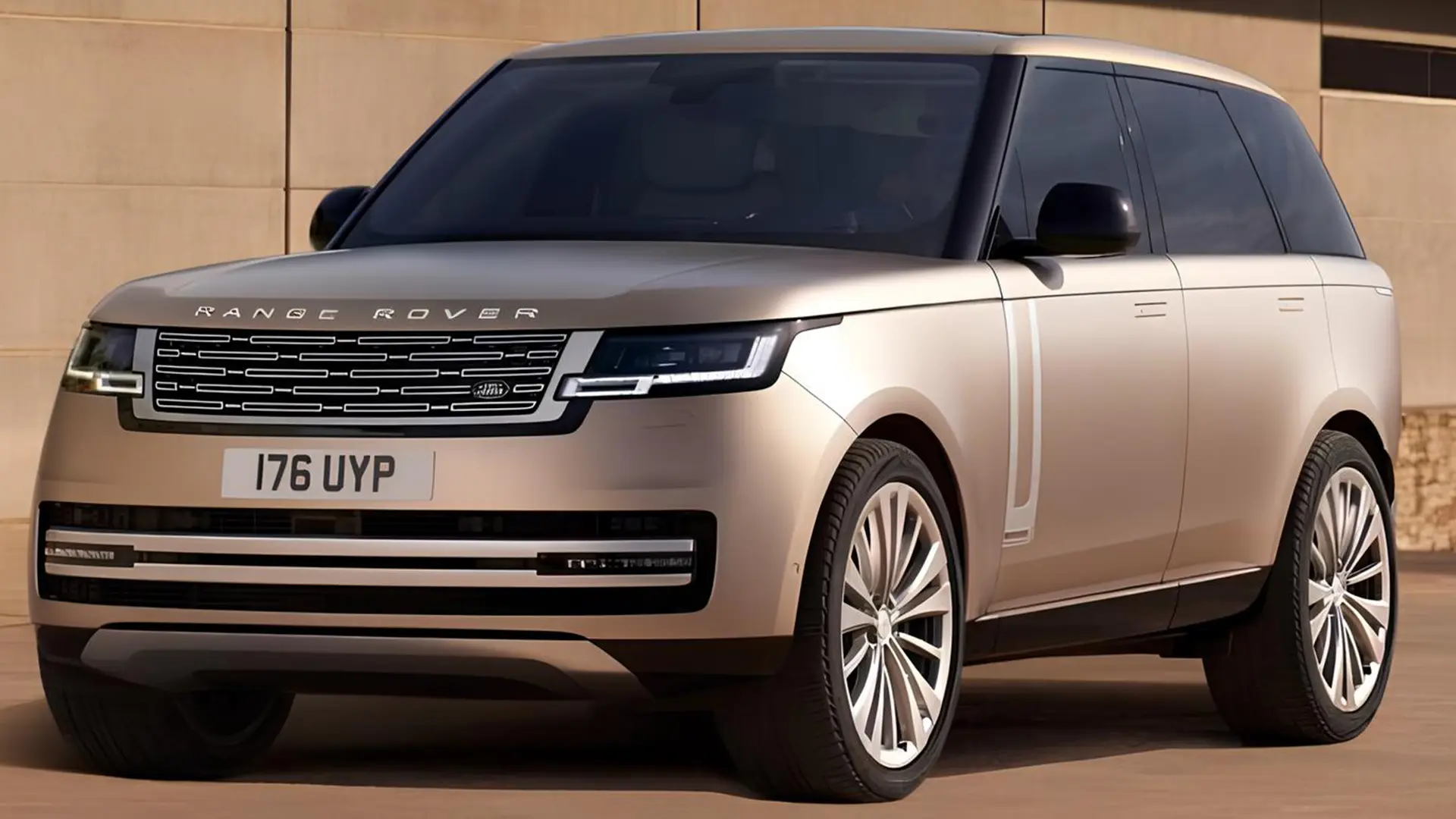 Бежевий Range Rover на вулиці біля сучасної будівлі, вигляд спереду збоку